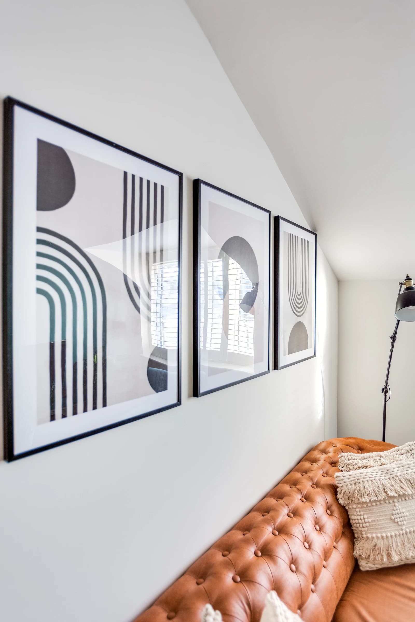 Modern black and white abstract artwork on white wall at Boon House serviced apartment